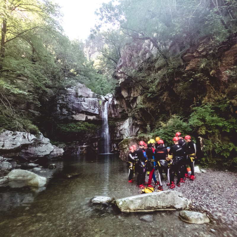 a man riding a motorcycle down a river
