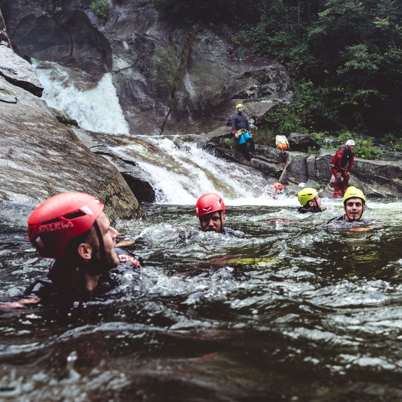 a group of people on a raft in the water