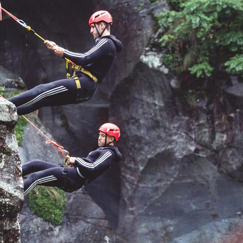 a man flying through the air while riding skis