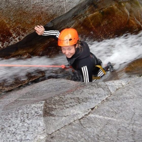 a person riding a skate board in the snow