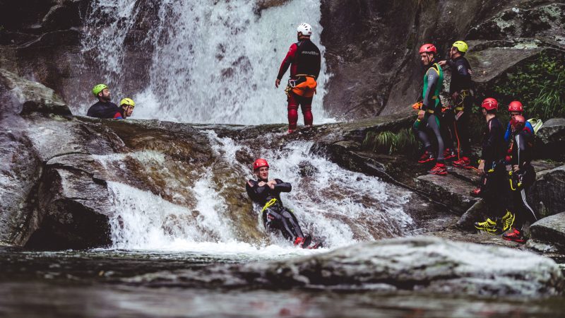 a group of people riding skis on top of a snow covered slope